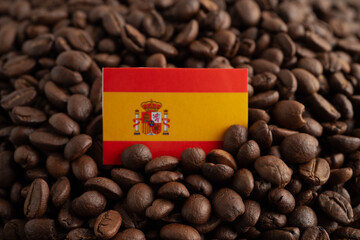 Spain flag with shopping cart box on coffee beans, shopping online for import export.