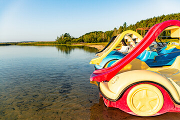 Early morning on the shore of a beautiful lake with attractions for children.