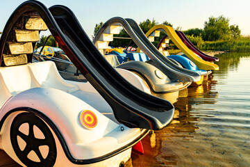 Early morning on the shore of a beautiful lake with attractions for children.