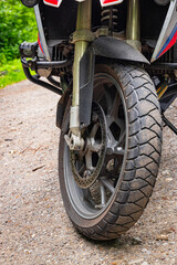 Side view of a motorcycle with a boxer engine, wheel, tires,
