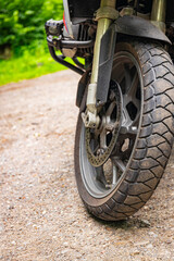 Side view of a motorcycle with a boxer engine, wheel, tires,