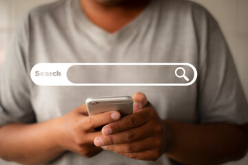 A concept for digital marketing and Search Engine Optimization (SEO). A person using a phone to search for keywords on an internet search engine, driving traffic to a website.
