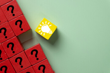 A concept of creative thinking and innovation. A bright idea lightbulb stands out, symbolizing a unique solution, brainstorming, and thinking outside the box to solve many questions.
