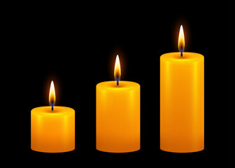 Burning candle. Yellow candle with golden flame on dark background.