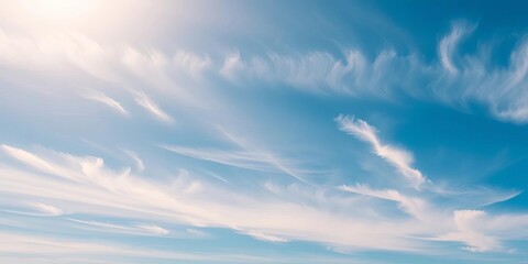 Obraz premium Vast, sunny sky; wispy cirrus clouds drift across a brilliant blue expanse, bright, sunny