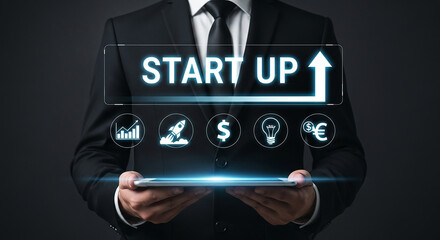 startup business technology, businessman holding digital tablet with glowing icons for launch investment profit idea and marketing innovation to grow new online company

