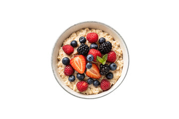 Bowl of hearty oatmeal with mixed berries including strawberries, blueberries, raspberries, blackberries and fresh mint, isolated on a transparent background