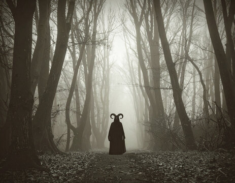 A demon stands in a foggy forest