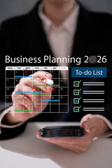 Professional entrepreneur businessman planning 2026 project schedule working on calendar event...