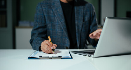 Businessman using on smartphone and tablet and laptop at officeBusinessman using on smartphone and tablet and laptop at office