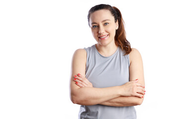 Confident smiling young woman with crossed hands