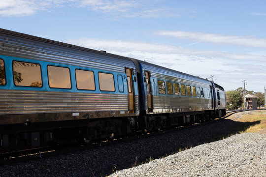 Looking along train and tracks at a signal box at a rural train station