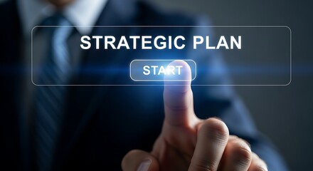 Businessman pressing start button on strategic plan