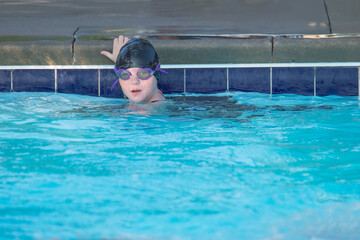 Young Girl Waits to Leave the Wall in Swim Practice