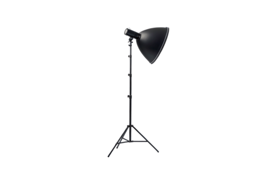 Black photography studio light with large reflector dish mounted on adjustable tripod stand, isolated on a transparent background