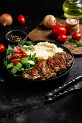 Deliciously Grilled Chicken Breast Slices Served with Mashed Potatoes and Salad