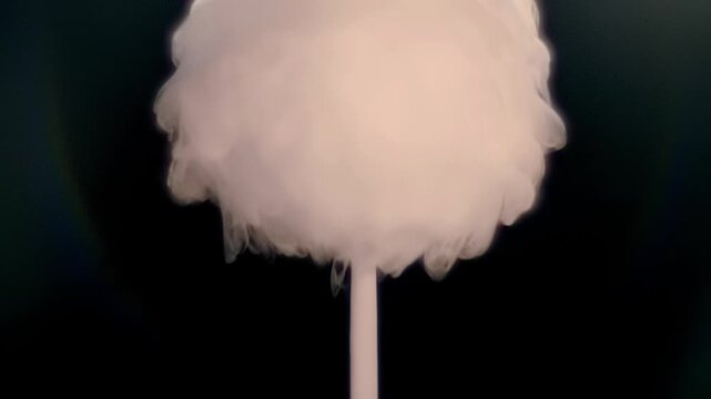 An air bubble filled with smoke explodes spectacularly, forming a beautiful cloud and waves. Closeup. Macro. Slow mo, slow motion, high speed camera, 200fps