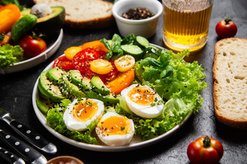 Healthy Salad Bowl with Avocado, Eggs, Tomatoes and Cucumbers,	