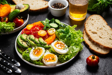 Healthy Salad Bowl with Avocado, Eggs, Tomatoes and Cucumbers,	