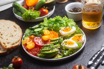 Healthy Salad Bowl with Avocado, Eggs, Tomatoes and Cucumbers,	