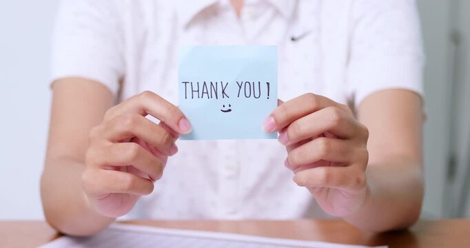 A heartfelt thank you expressed through a simple note showcasing appreciation a personal moment.