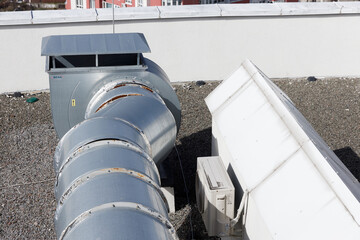 Industrial Ventilation System on Rooftop: Highlighting Vent Pipes and HVAC Equipment for Efficient Air Circulation and Maintenance in Commercial Buildings