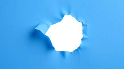 Ripped transparent hole in blue paper