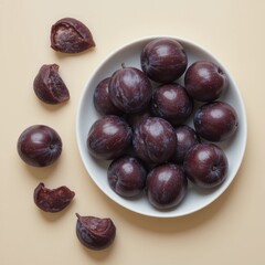 Obraz premium Harvesting fresh plums kitchen table food photography minimalist setting top view healthy eating concept