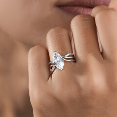 woman elegant finger ring with white diamond
