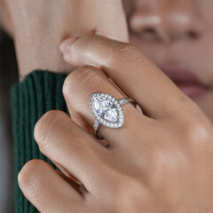 woman elegant finger ring with white diamond
