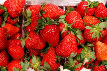 A Vibrant Display of Fresh Strawberries Perfect for Summer Salads, Desserts, and Smoothies Rich in Vitamins and Antioxidants for Healthy Snacking and Culinary Delights