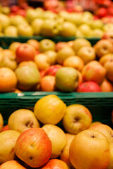 A Vibrant Display of Fresh Apples in Various Colors and Varieties at a Local Market or Grocery Store, Showcasing the Abundance of Nature's Bounty and Seasonal Harvests