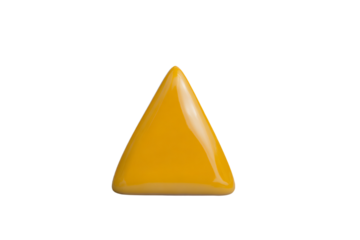 a yellow triangular shaped object on a white surface