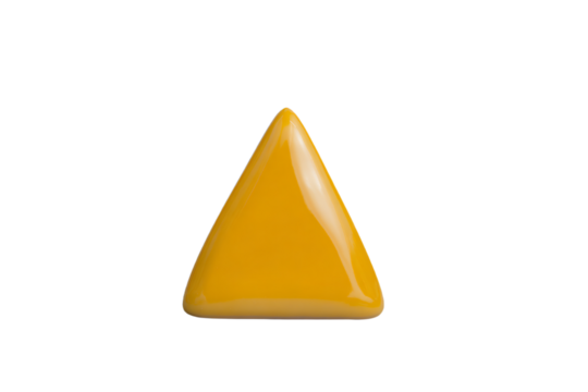 a yellow triangular shaped object on a white surface