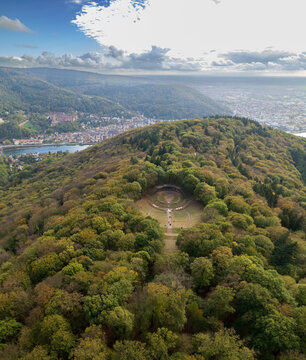 Aerial view of the lush, green forested hill revealing the distinct geometric form of the Thingst&Atilde;&curren;tte amphitheater, Heidelberg, Baden-W&Atilde;&frac14;rttemberg, Germany.
