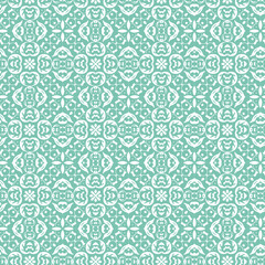 Seamless vintage ornamental pattern with intricate floral and geometric elements. A beautiful decorative white design on a turquoise background.