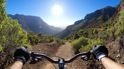 Person riding bicycle on scenic trail surrounded by lush greenery and natural beauty of outdoors
