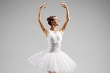 Ballerina dancing with arms up