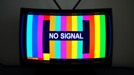 A vintage television screen displaying "NO SIGNAL" with colorful static stripes.