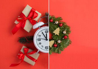 Collage with white alarm clock, Christmas wreath and gifts on a red background. Top view. Close-up.