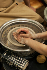 Clay sculpture taking shape on wheel 