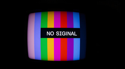 a vintage television screen displaying colorful stripes and a "no signal" message.