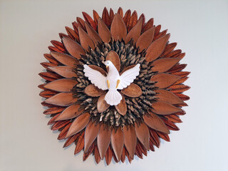 Holy Spirit made with natural materials on a white background.