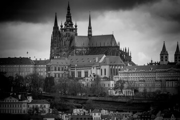 A panoramic view of Prague Castle, captured from the Old Town Hall Tower, showcases red-roofed...