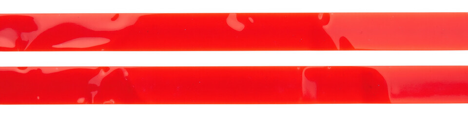 Obraz premium Bright red glossy strips, smooth surface, vibrant color, ideal for crafts, decoration, or design projects. Perfect for adding pop of color