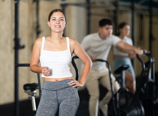 Portrait of a crossfit trainer girl in the gym
