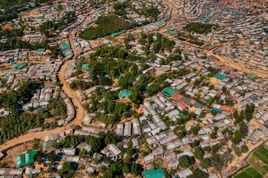 Aerial view of shelters, roads, and trees create a textured landscape, with concentrated housing around Balukhali Bazar, Chittagong Division, Bangladesh.