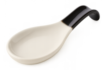 Clean ceramic spoon rest with a black handle, perfect for keeping kitchen surfaces clean while cooking
