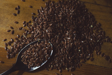 flax seeds on a wooden table close-up