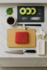 Minimalist sushi preparation setup with fresh tuna fillet, avocado, and sushi ingredients on marble kitchen worktop

